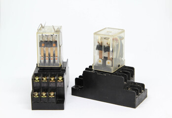 The electrical auxiliary relay in transparent plastic cases on white background.