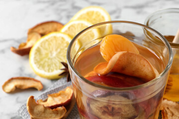 Delicious compote with dried fruits in glass on table, closeup. Space for text