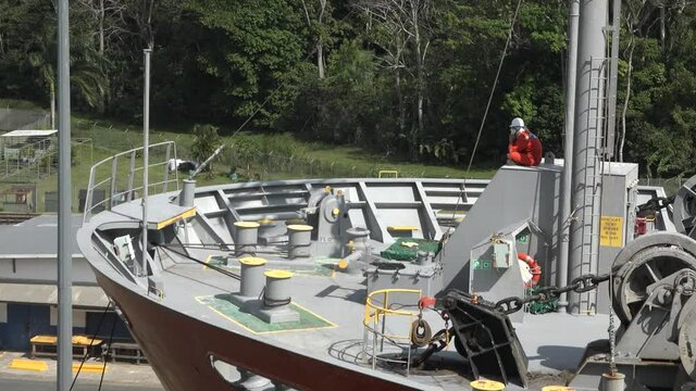 A cargo ship passes through the gates of the Panama Canal.