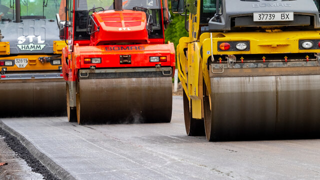 Ukraine, Khmelnytsky region, Krasyliv. May 2021. Rollers for laying asphalt on the road during asphalt compaction. Road repair. Laying a new road