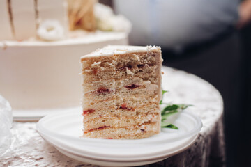 a piece of a yummy cake on a plate in the kitchen