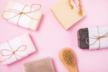Spa Kit Handmade Soap Bars Bamboo Face Brush Spa or Beauty Concept Top View Pink Background