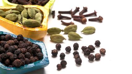 Obraz premium Group of Organic Black pepper isolated on white background. Selective focus and Top view (Flat Lay)