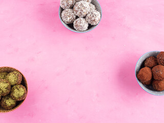 Healthy energy balls with nut butter, dried fruit, oats, seeds. Cocoa, coconut and matcha flavours