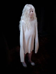 Beautiful  albino girl on black background