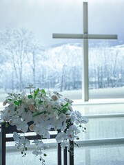 cross in the church in the snow