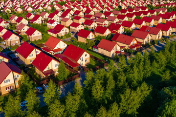 Aerial panorama - residential buildings. Residential two-story houses. Private suburbs houses. Two-storey cottages are located close to each other. Aerial view high Above suburbs houses