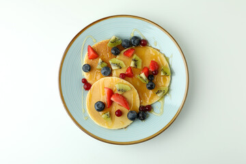 Concept of delicious dessert with pancakes on white background
