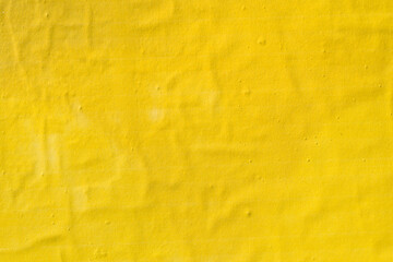 Texture of yellow printed poster paper as copy space