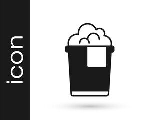 Black Bucket with foam and bubbles icon isolated on white background. Cleaning service concept. Vector