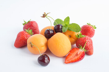 Close-up on fruit and berry on the white background. Copy space.