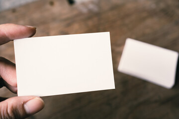 Pile of white blank space business name cards stack template for advertise and marketing on wooden...