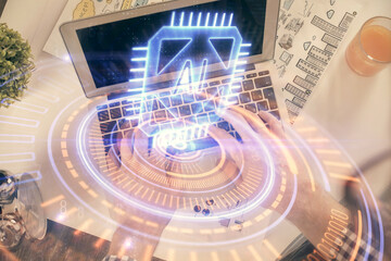 Multi exposure of man's hands typing over computer keyboard and data theme hologram drawing. Top view. Technology concept.