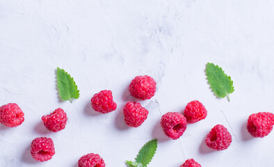 An ornament of raspberries and blueberries on a light background.