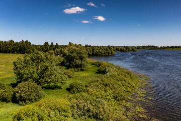 Fototapeta premium panoramic view from the drone to the village of a large lake and forest and fields and roads 