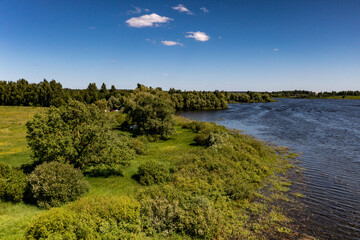 panoramic view from the drone to the village of a large lake and forest and fields and roads 