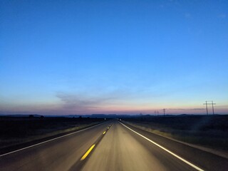 Night time road with headlights