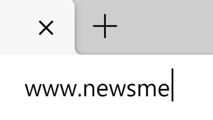 Typing WWW News Media Website Into Address Bar. Searching For Headline Press Release Network Website. Searching The World Wide Web Internet on a Computer. Search for Information Webpage.