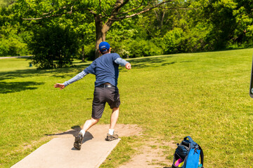 Disc golf is a flying disc sport in which players throw a disc at a target; it is played using...