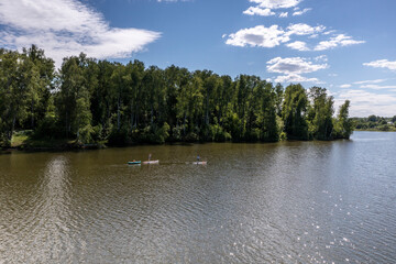 panoramic view from the drone to the village of a large lake and forest and fields and roads 