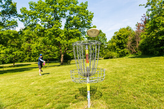 Disc golf is a flying disc sport in which players throw a disc at a target; played using rules like golfs. 