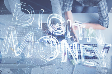 Double exposure of man and woman working together and crypto theme hologram drawing. Computer background. Blockchain concept. Top View.