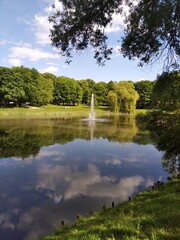 Olsztyn - Jakubowo Park with a pond and a fountain.