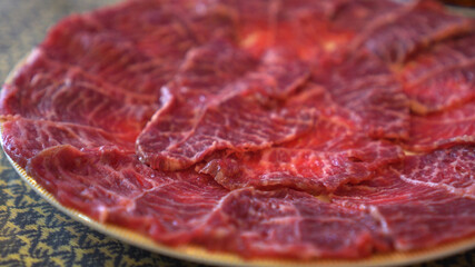 Close up full plate sliced red and fat beef meat Asian style food preparation