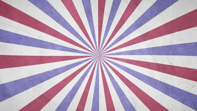 A rotating red, white and blue grunge carnival circus style retro background with vintage film effects