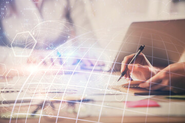 Double exposure of woman hands working on computer and world map hologram drawing. International technology business concept.