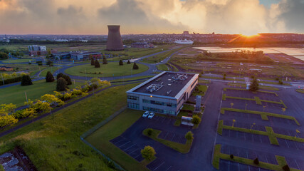 Old metal factory chimney in Caen, Colombelles, Normandy, drone photo at sunset, industrial area
