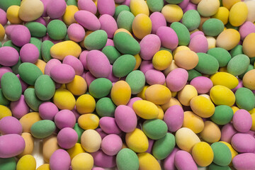 Group of colorful peanuts in glaze.