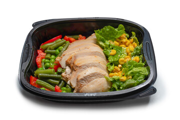 Ready food in a container. Stewed chicken, stewed vegetables.