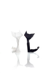 Origami cats over white background