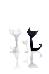 Origami cats over white background