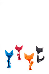 Origami cats over white background
