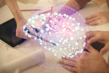 Double exposure of man and woman working together holding and using a mobile device and brain hologram drawing.