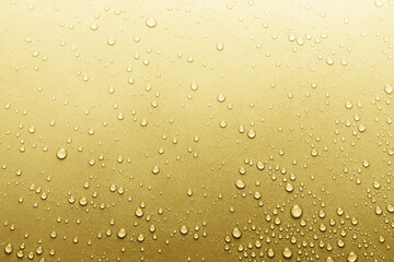 Water drops on golden surface, background