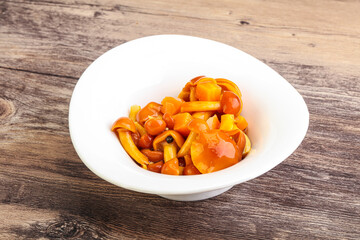 Marinated pickled honey mushrooms in the bowl