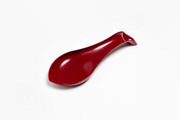 Plastic spoon holder isolated on white background. High-resolution photo.