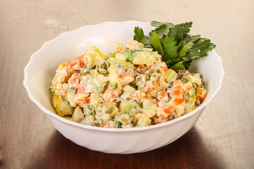 Russian traditional salad with green peas