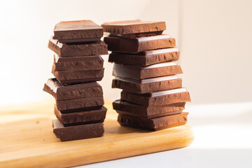 World Chocolate Day pieces of chocolate on a wooden board