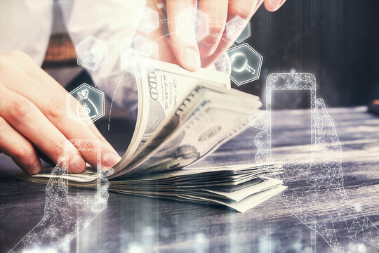 Multi exposure of Tech drawing hologram and USA dollars bills and man hands. Technology concept.