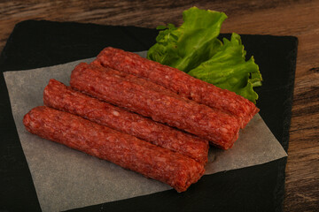 Raw beef sausages with spices