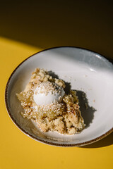 apple crumble with sesame seeds and ice cream bowl