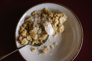 apple crumble with sesame seeds and ice cream bowl