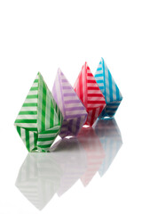 Origami balloons made of colored papers isolated on white background