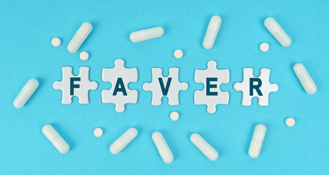 On a blue background, there are pills and puzzles with the inscription - FAVER