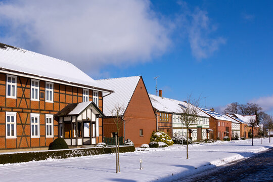 View into a small street of a typical village in the Altmark region in winter.