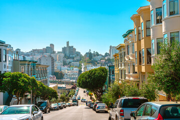A street in the center of the city with a sloping road and a beautiful view of the downtown. San Francisco, USA - 17 Apr 2021 © KseniaJoyg